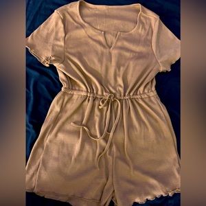 Brand new Romper with drawstring.